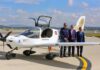 three men in front of the Halcón aircraft