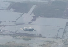 an aerial photo shows the terminal of Mexico City's canceled airport sinking into Lake Texcoco