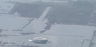 an aerial photo shows the terminal of Mexico City's canceled airport sinking into Lake Texcoco