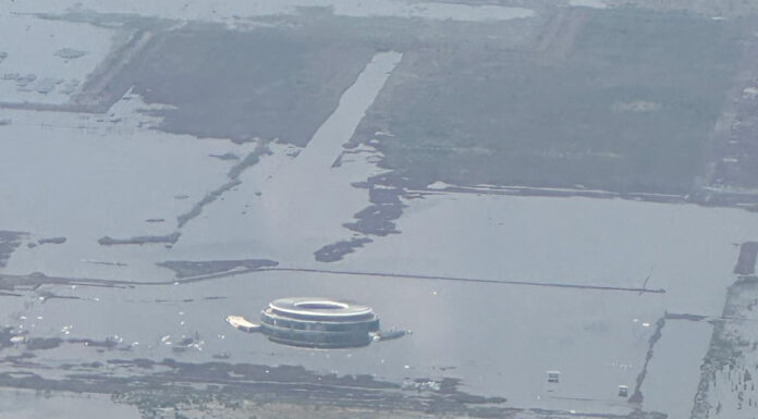 an aerial photo shows the terminal of Mexico City's canceled airport sinking into Lake Texcoco