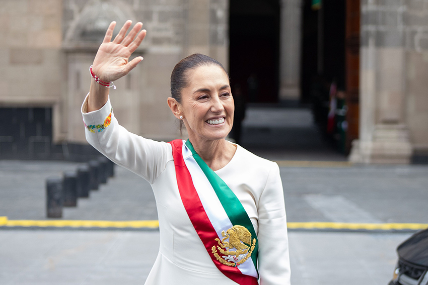 President Sheinbaum waves as she enters the national palace to take the oath of office in Oactober 2024