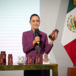 Sheinbaum holds a jar of Mexican government Wellness Coffee