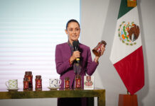Sheinbaum holds a jar of Mexican government Wellness Coffee