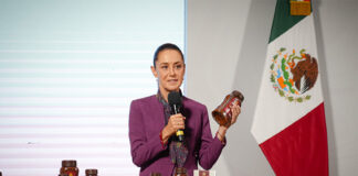 Sheinbaum holds a jar of Mexican government Wellness Coffee