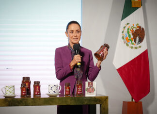 Sheinbaum holds a jar of Mexican government Wellness Coffee
