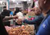 A person doing grocery shopping at a market in Mexico