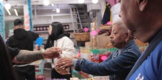 A person doing grocery shopping at a market in Mexico