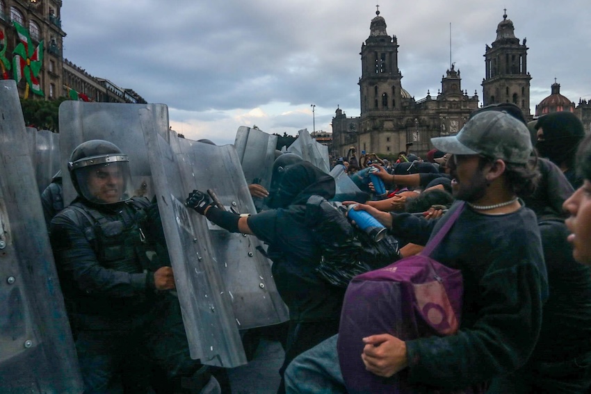 Protesters attacking police in the Zócalo