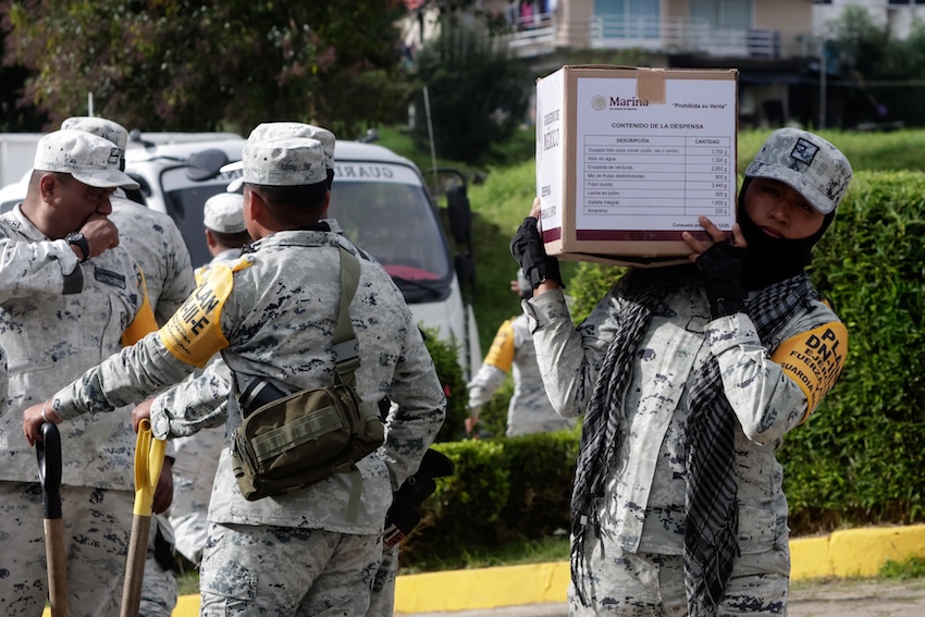 Soldiers carrying aid