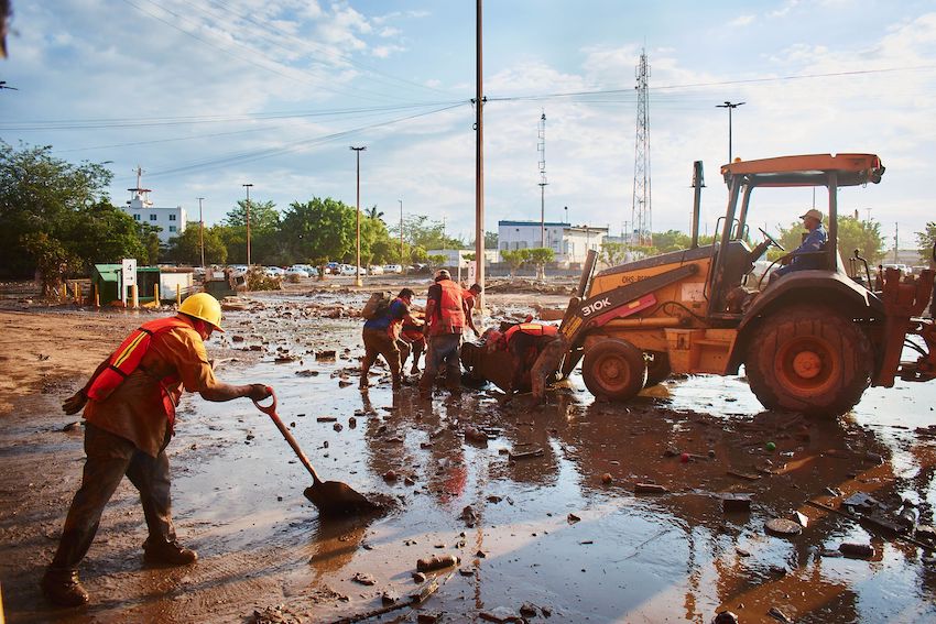Cleanup teams are prioritizing the removal of standing water, which could create breeding grounds for a dengue outbreak and worsen the crisis.