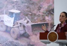 Sheinbaum and graphic of machinery