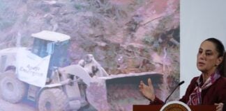 Sheinbaum and graphic of machinery