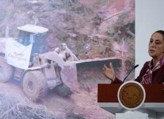 Sheinbaum and graphic of machinery
