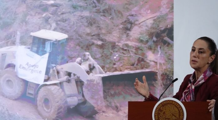 Sheinbaum and graphic of machinery