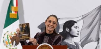 Sheinbau, showing her book