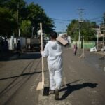 A sanitation worker delivers aid in flood-stricken Veracruz, Mexico