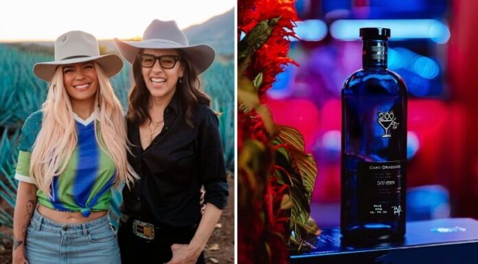 Singer Karol G poses for a photo with Casa Dragones' Bertha González Nieves