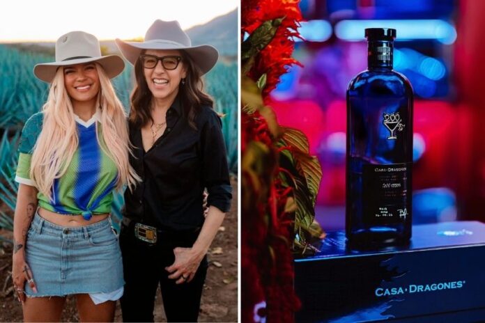 Singer Karol G poses for a photo with Casa Dragones' Bertha González Nieves