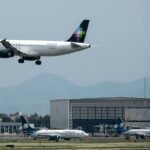 Trump administration revokes 13 flight routes from Mexico to US volaris plance in air