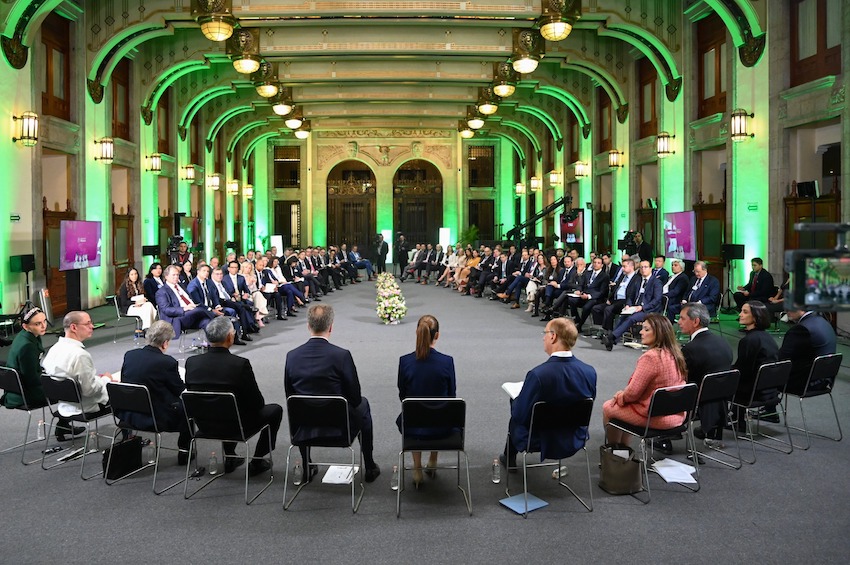 Sheinbaum and cabinet members seated facing members of the World Economic Forum on Wednesday