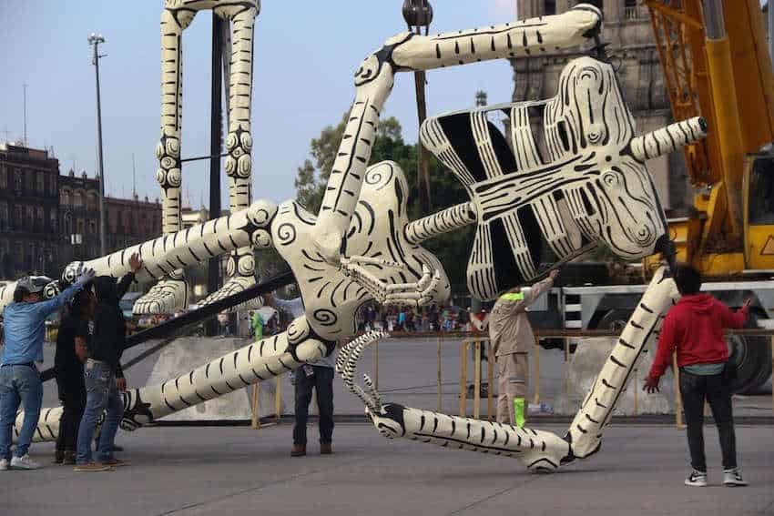 Workers acceptable   up   the mega ofrenda astatine  Mexico City's Zocalo, which is simply a insubstantial  maiche larger-than beingness  accepted   calavera skeleton.