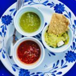 A plate with three different types of Mexican salsa