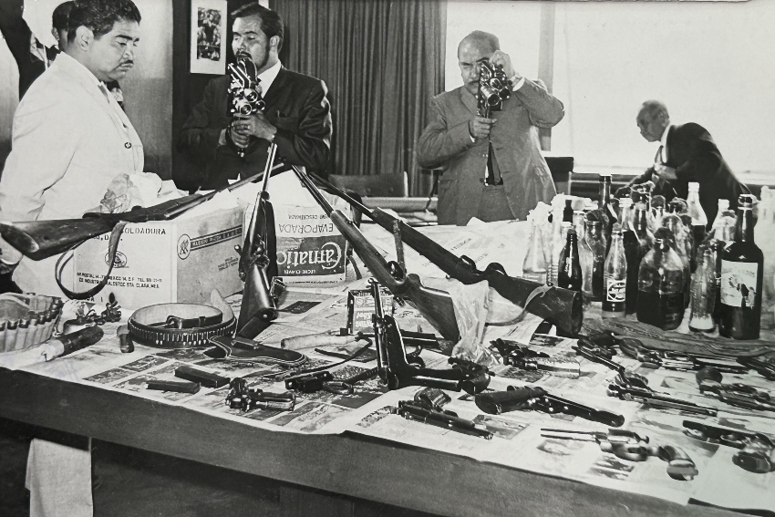 Authorities pose with weapons