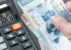 Stock image of a 500 Mexican peso bill next to a calculator