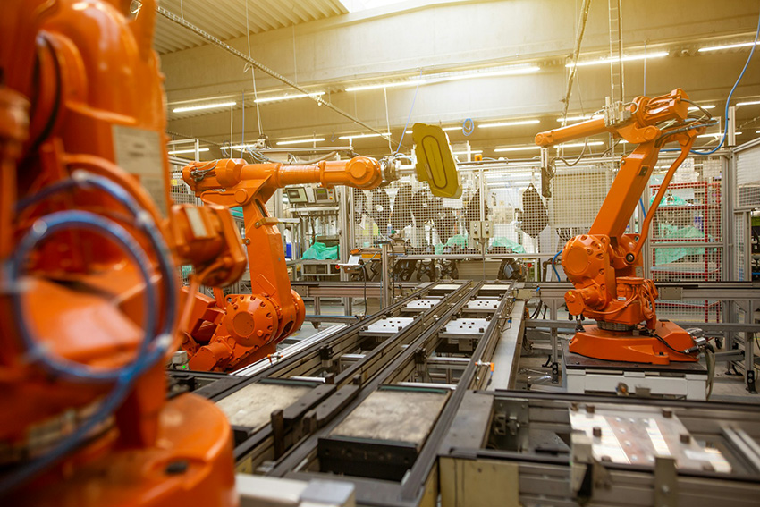 Robotic arms in a manufacturing facility