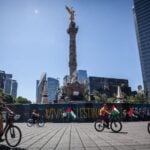 Cyclists enjoy a car-free Paseo Dominical along Reforma Avenue in Mexico City.