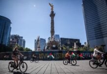Cyclists enjoy a car-free Paseo Dominical along Reforma Avenue in Mexico City.