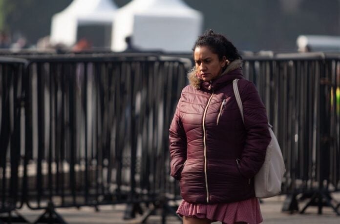 A woman bundled up due to cold