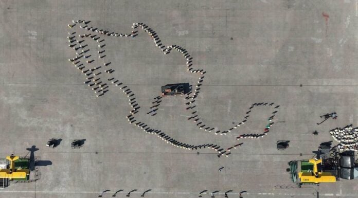 Aerial view of the line-up before the start of the parade and civic-military ceremony marking the 115th anniversary of the start of the Mexican Revolution in the Zócalo square.