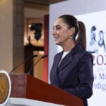 Sheinbaum at the podium of a press conference