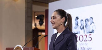 Sheinbaum at the podium of a press conference