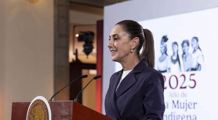 Sheinbaum at the podium of a press conference