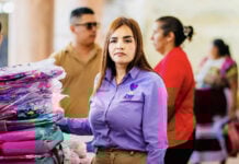 Grecia Quiroz in a purple shirt with the words DIF