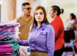 Grecia Quiroz in a purple shirt with the words DIF