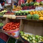 fruits and vegetables on display at a market
