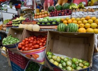 fruits and vegetables on display at a market