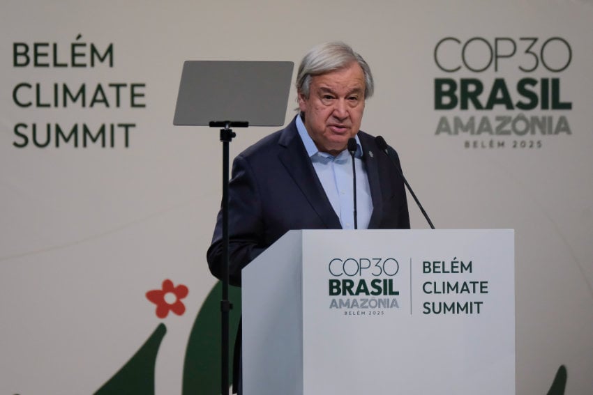 UN Secretary-General António Guterres, standing at a podium surrounded by imprints indicating that this is the COP30 summit in Belém, Brazil. He's giving a speech to set the stage for discussion of climate change committments at this year's conference.