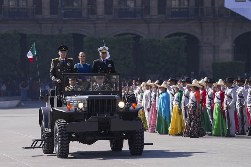 Sheinbaum and several Mexican generals ride in a military jeep in the Revolution Day parade