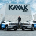Carlos García Ottati poses in front of a Kavak office