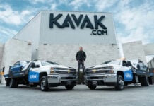 Carlos García Ottati poses in front of a Kavak office