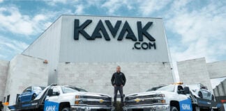 Carlos García Ottati poses in front of a Kavak office