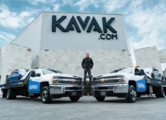 Carlos García Ottati poses in front of a Kavak office