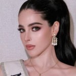 A closeup photo of Miss Universe Mexico, Fatima Bosch, with a sash and heavy makeup