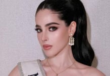 A closeup photo of Miss Universe Mexico, Fatima Bosch, with a sash and heavy makeup