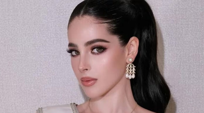 A closeup photo of Miss Universe Mexico, Fatima Bosch, with a sash and heavy makeup