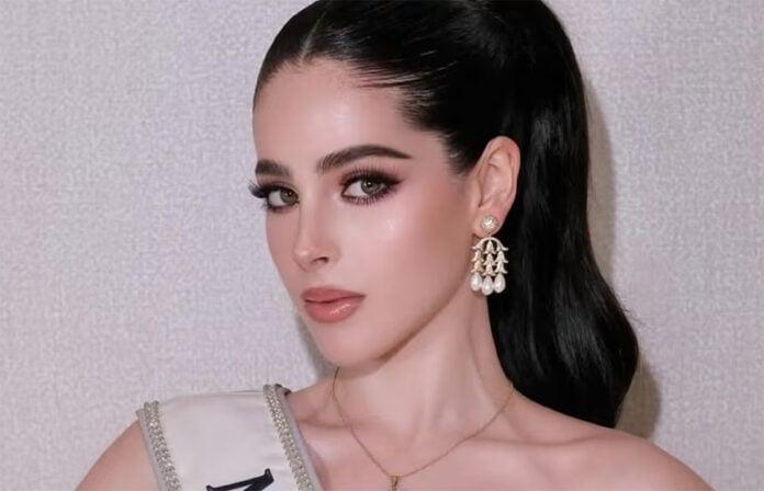 A closeup photo of Miss Universe Mexico, Fatima Bosch, with a sash and heavy makeup